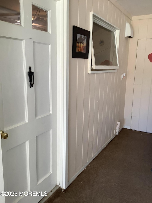 interior space featuring wood walls