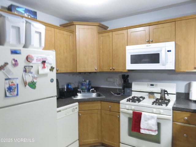 kitchen featuring sink and white appliances