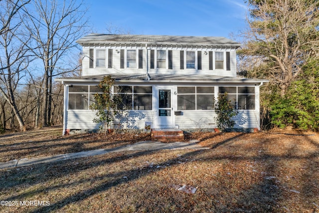 view of front facade with a sunroom