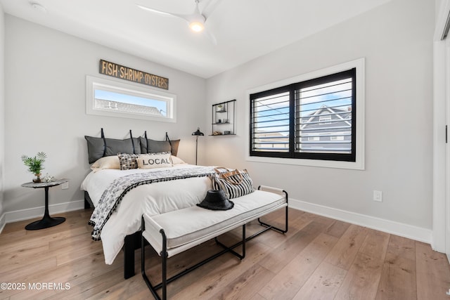 bedroom featuring ceiling fan and hardwood / wood-style floors