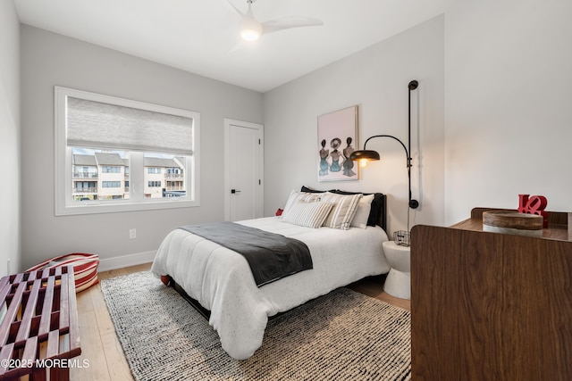 bedroom featuring ceiling fan and wood-type flooring