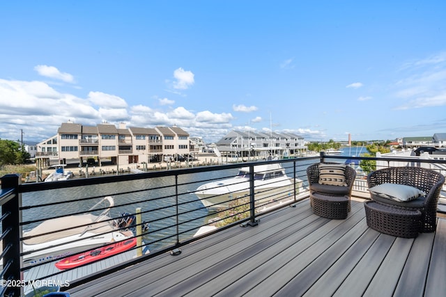 wooden deck with a water view