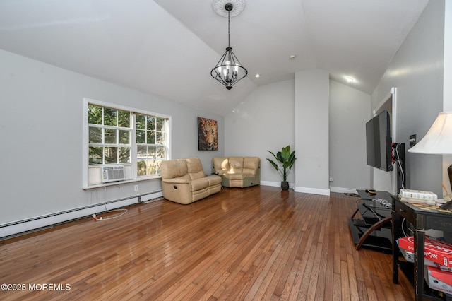 living area featuring baseboard heating, an inviting chandelier, vaulted ceiling, and hardwood / wood-style floors