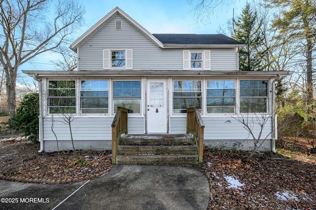 view of front of home with a sunroom