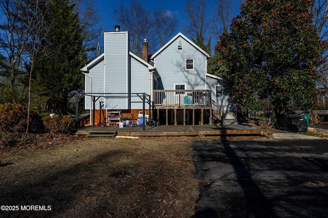 rear view of house with a wooden deck