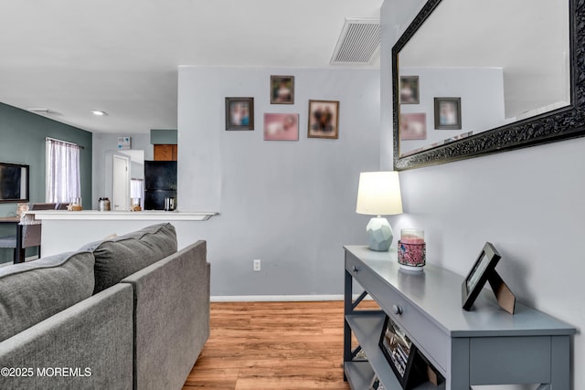 living room featuring light wood-type flooring