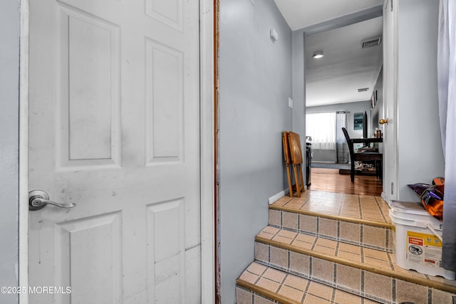 stairs with tile patterned flooring