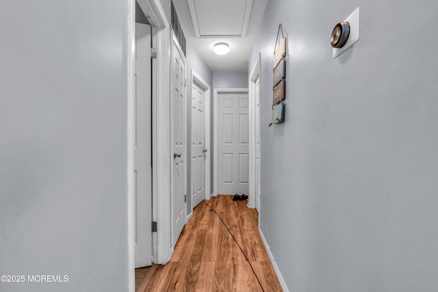 corridor featuring light wood-type flooring