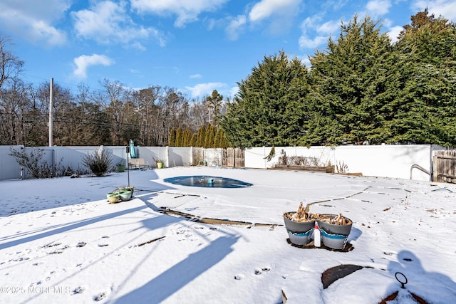 view of snow covered pool