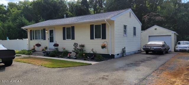 view of front of property with an outdoor structure and a garage