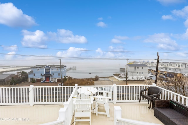 deck featuring a water view