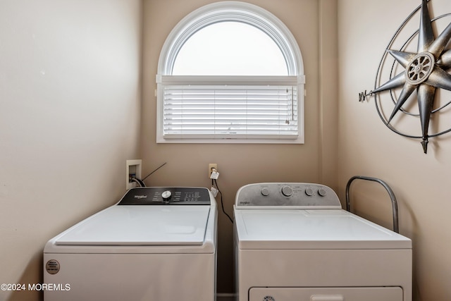 washroom featuring washer and clothes dryer