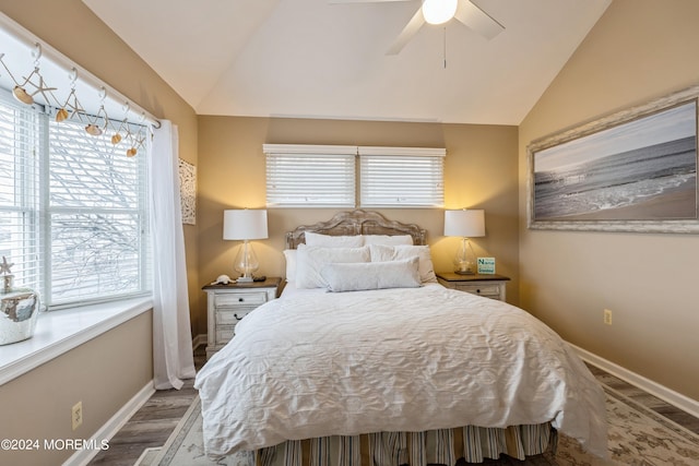 bedroom with vaulted ceiling, ceiling fan, and hardwood / wood-style flooring