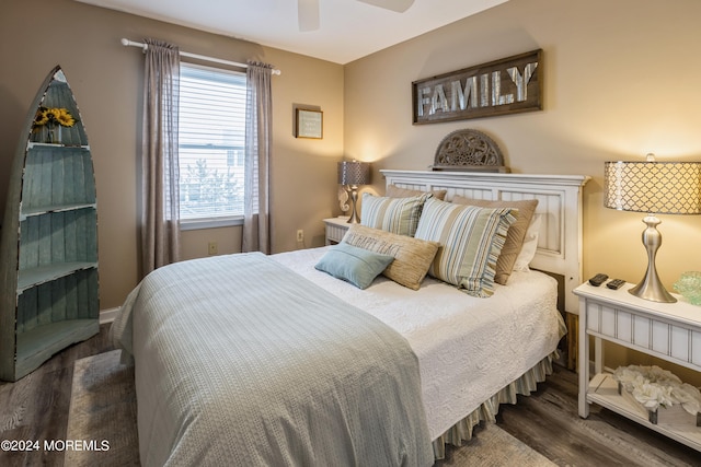 bedroom with ceiling fan and hardwood / wood-style flooring