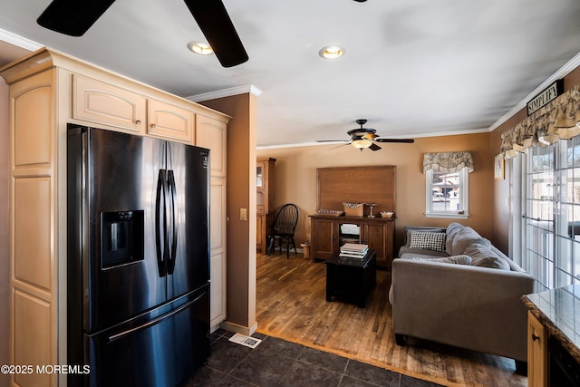 kitchen with ceiling fan, dark tile patterned flooring, crown molding, and refrigerator with ice dispenser