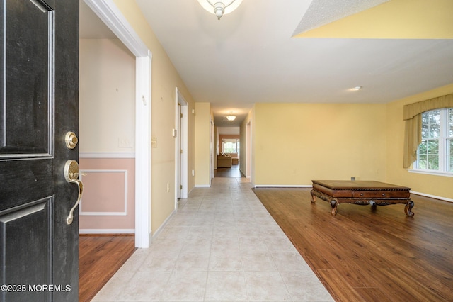 entryway with light hardwood / wood-style flooring