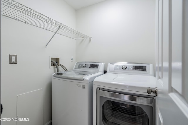 laundry room featuring separate washer and dryer