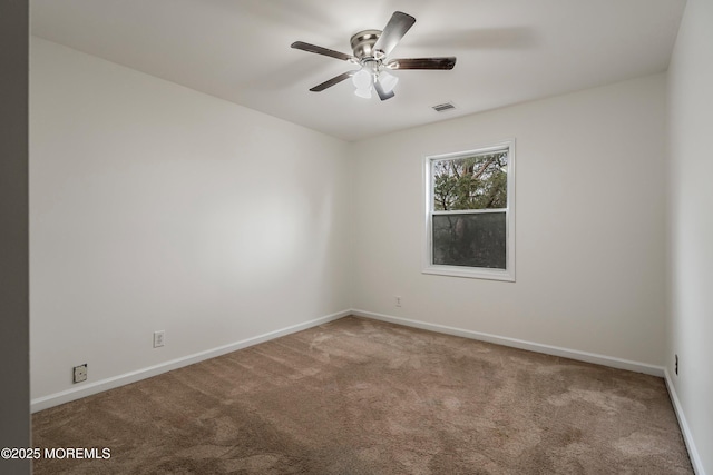 carpeted empty room with ceiling fan