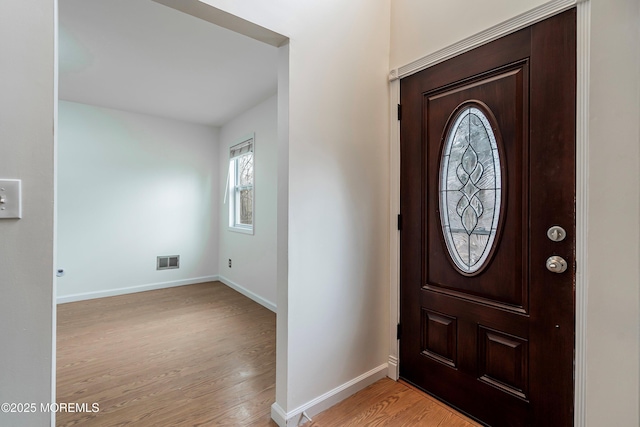 entryway with light hardwood / wood-style flooring