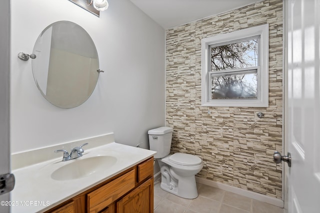 bathroom featuring tile patterned floors, vanity, and toilet