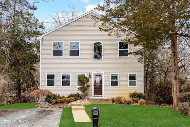 view of front of home featuring a front lawn