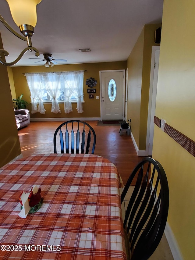 dining area featuring ceiling fan and hardwood / wood-style flooring