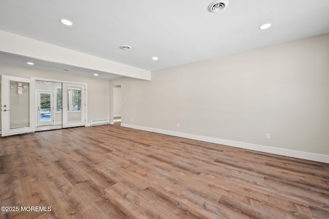 interior space with light wood-type flooring and french doors