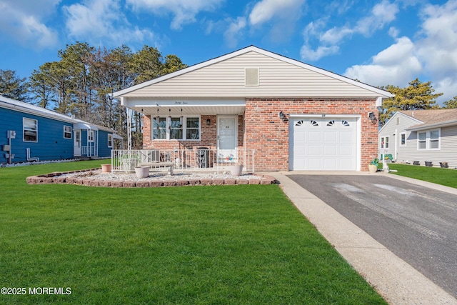 view of front facade with a garage, a porch, and a front yard