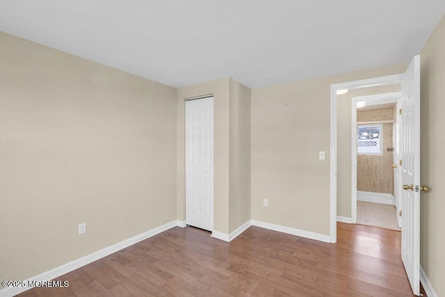 spare room featuring wood-type flooring