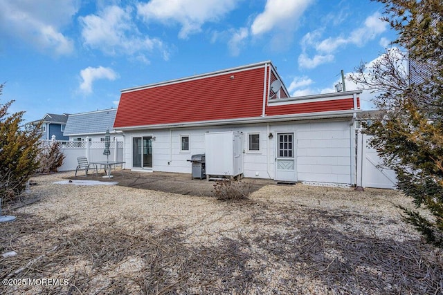 rear view of house featuring a patio