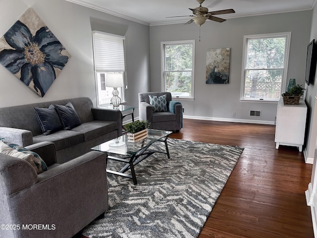 living room featuring baseboards, visible vents, a ceiling fan, ornamental molding, and wood finished floors