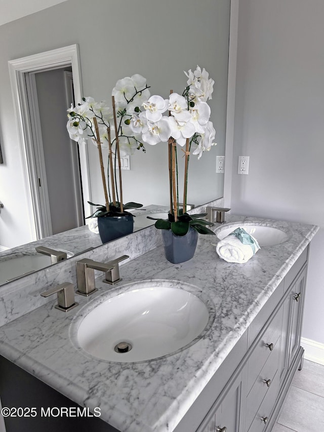 room details featuring double vanity and a sink