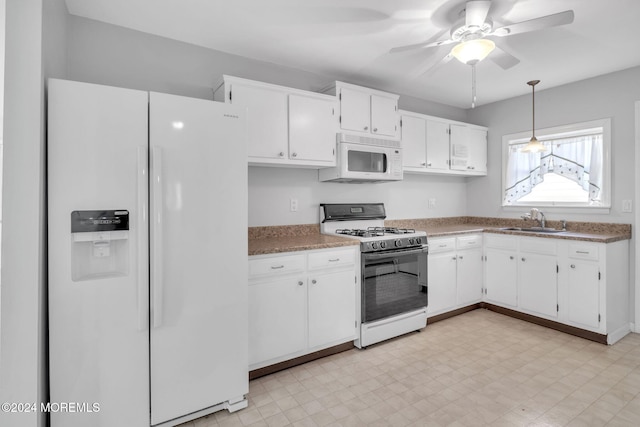 kitchen featuring white cabinetry, sink, white appliances, and pendant lighting