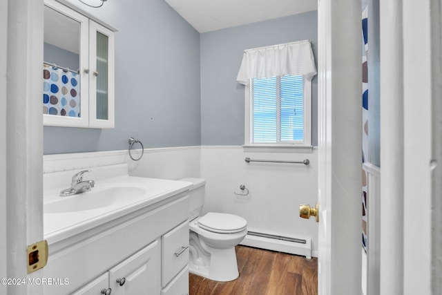 bathroom with toilet, baseboard heating, wood-type flooring, and vanity