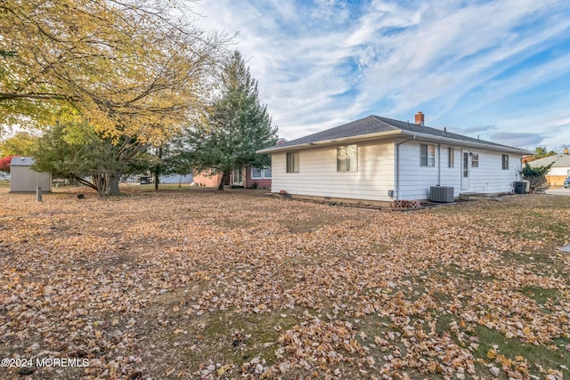 view of side of property featuring central AC