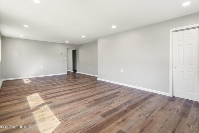 empty room featuring wood-type flooring