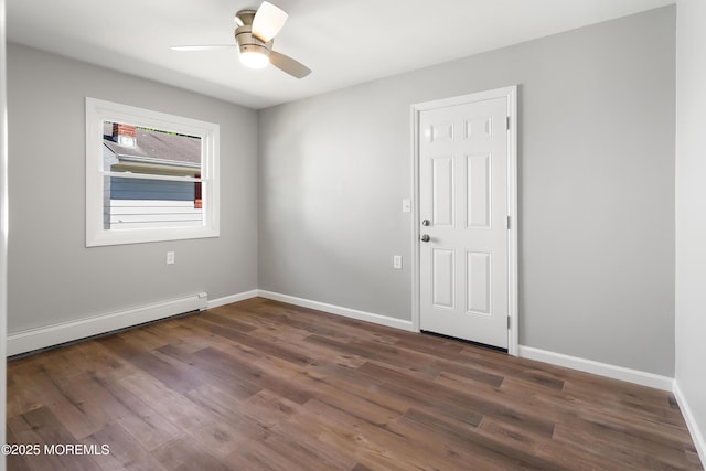 empty room with ceiling fan, dark hardwood / wood-style floors, and a baseboard radiator