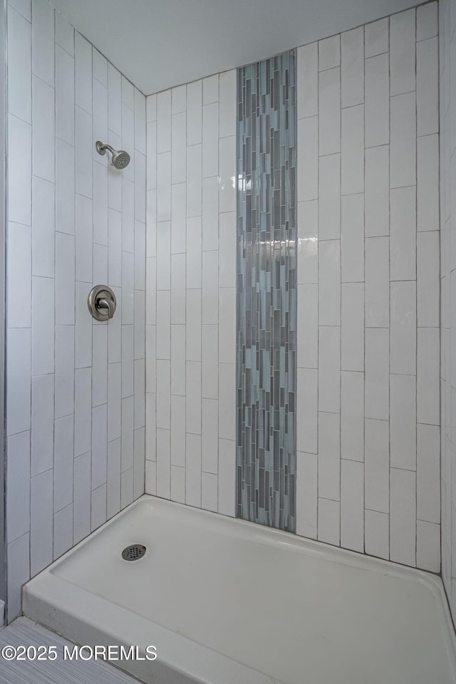 bathroom with a tile shower