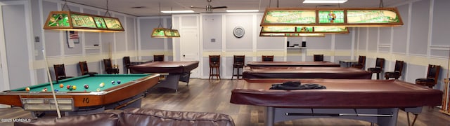 game room with billiards and hardwood / wood-style flooring