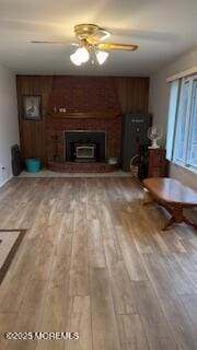 unfurnished living room with ceiling fan and hardwood / wood-style flooring