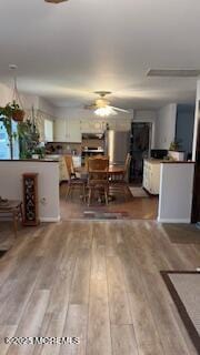 unfurnished dining area featuring light hardwood / wood-style flooring