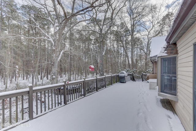 view of snow covered deck