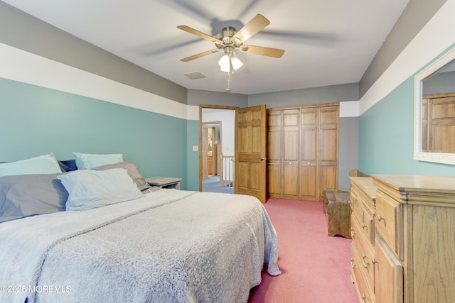 carpeted bedroom with ceiling fan