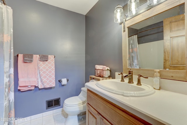 bathroom featuring vanity, toilet, and tile patterned floors