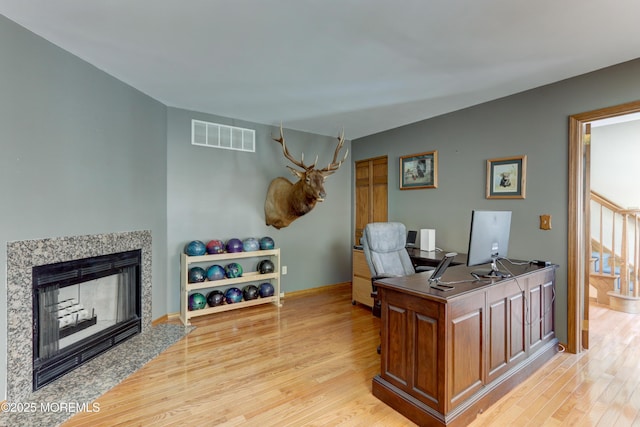 office area with light hardwood / wood-style flooring