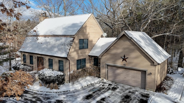 cape cod home with a garage