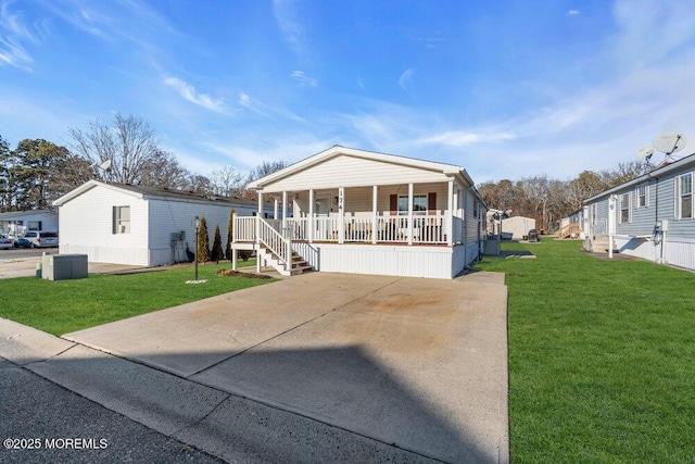 view of front of home featuring covered porch and a front lawn