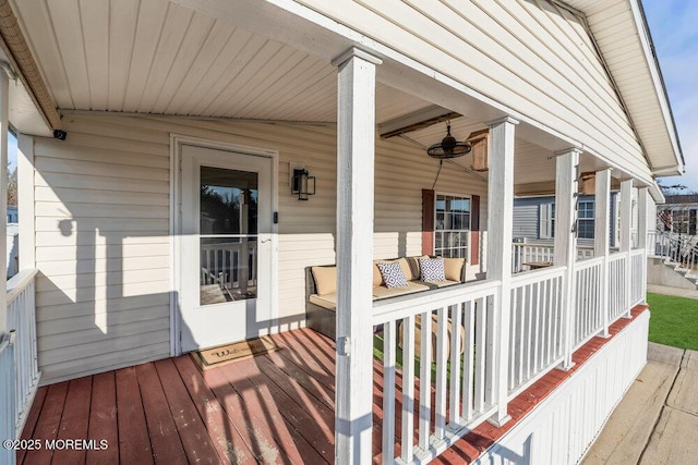 deck featuring ceiling fan and a porch