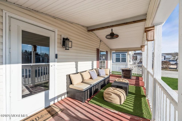 balcony featuring covered porch and outdoor lounge area