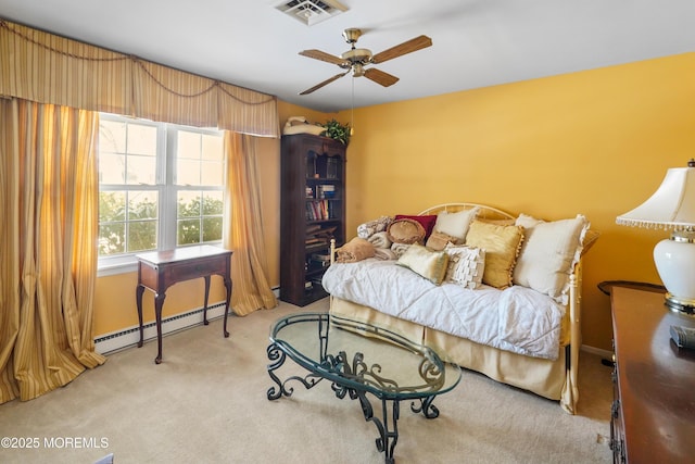 bedroom with ceiling fan, light carpet, and a baseboard heating unit